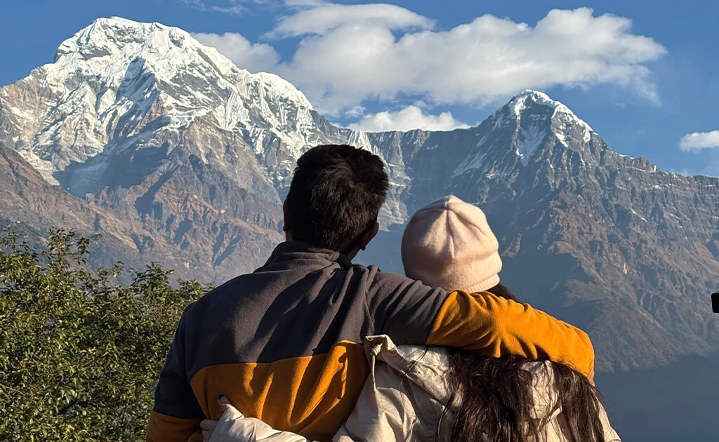 Looking at snow-capped Himalayan peaks under a blue sky from Ghandruk.