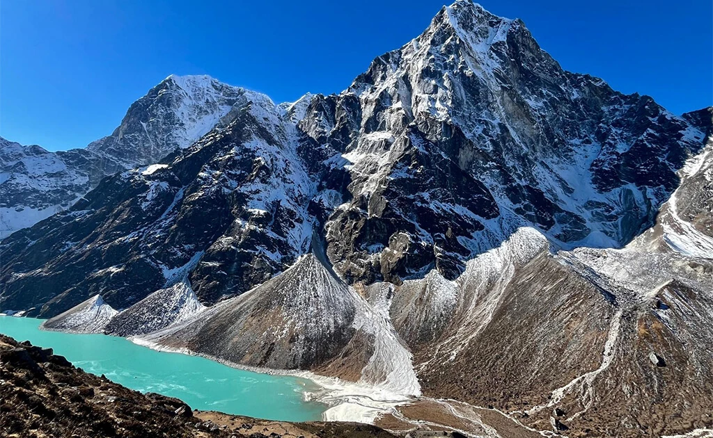 Turquoise Gokyo Lake with snow-capped Himalayan mountains seen from Gokyo Ri