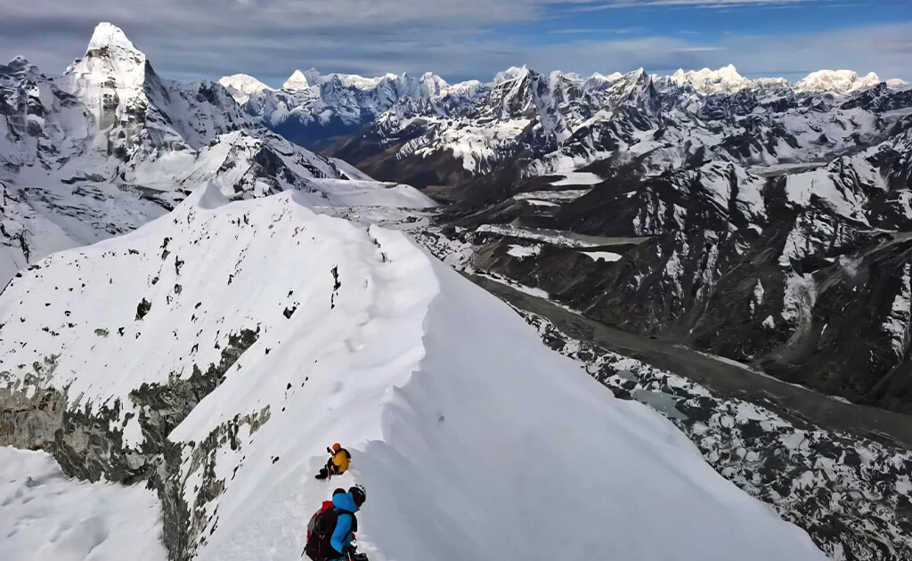 Climbers on a snowy ridge