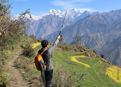 snow-capped Himalayan mountains and farmland of local villegers