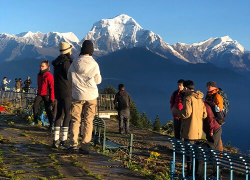 Visitors enjoying sunrise views of the Annapurna and Dhaulagiri ranges from Poon Hill