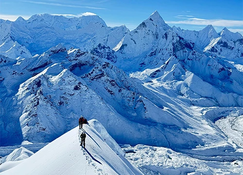 Climbers on Lobuche Peak ridge with Everest region giants