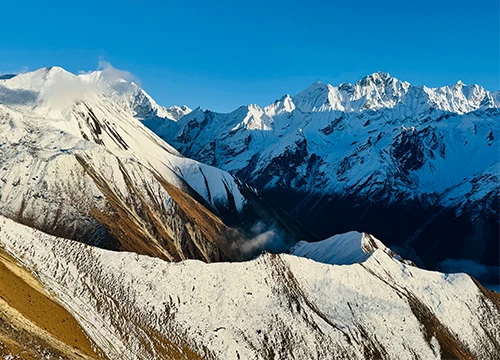 Snow-covered Himalayan mountains seen from kyangjin ri